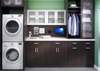 Closet Solutions custom build cabinets, counter top and storage for laundry and cleaning.